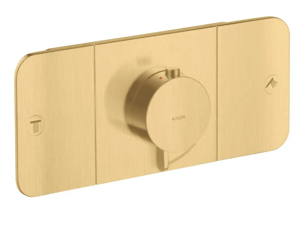 Thermostatmodul in gebürsteter Goldoptik von AXOR mit einem zentralen Einstellrad und Symbolen für Temp- und Duschsteuerung. Dezentralisierte Montage für zwei Verbraucher.